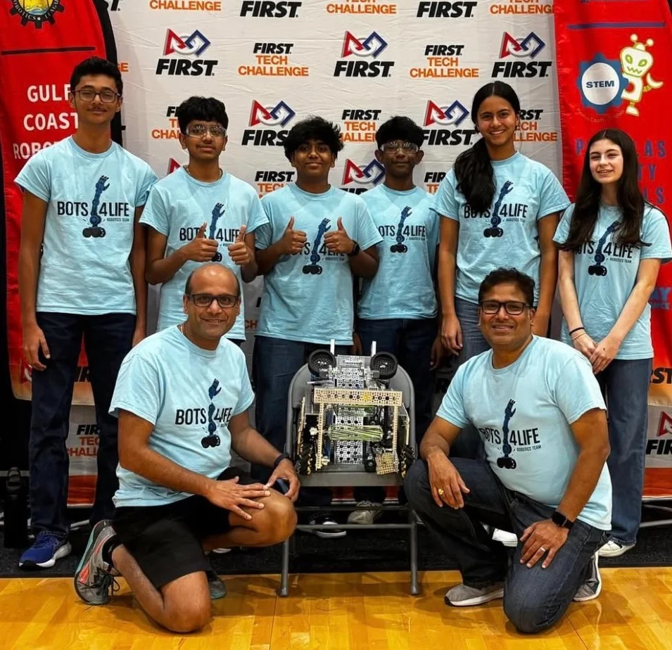 Bots4Life FIRST Tech Challenge team with their robot at a Gulf Coast Robotics competition
